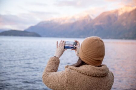 lady taking picture of sea