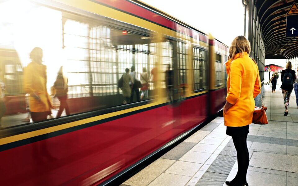 woman standing near train