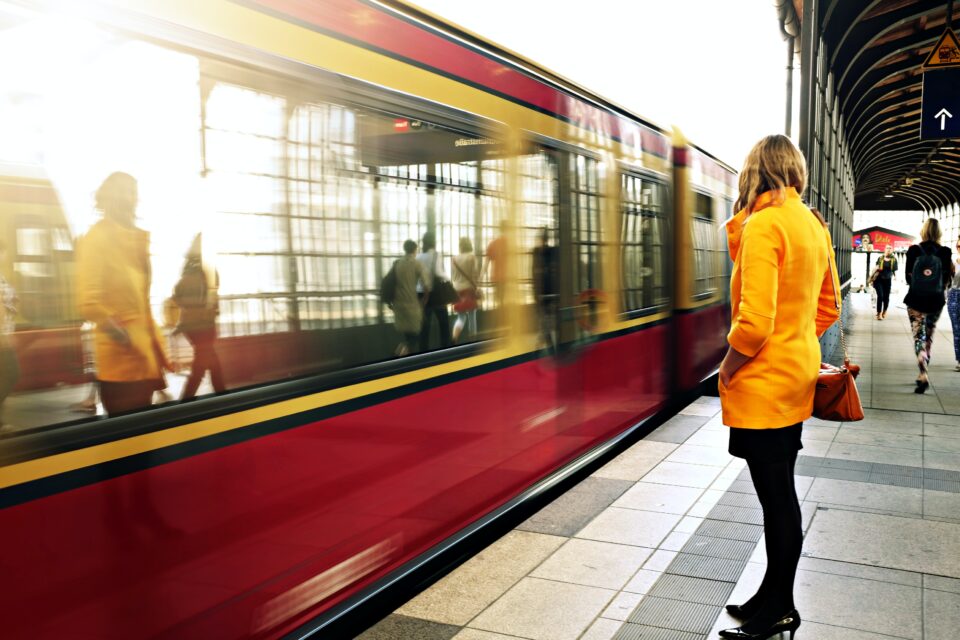 woman standing near train