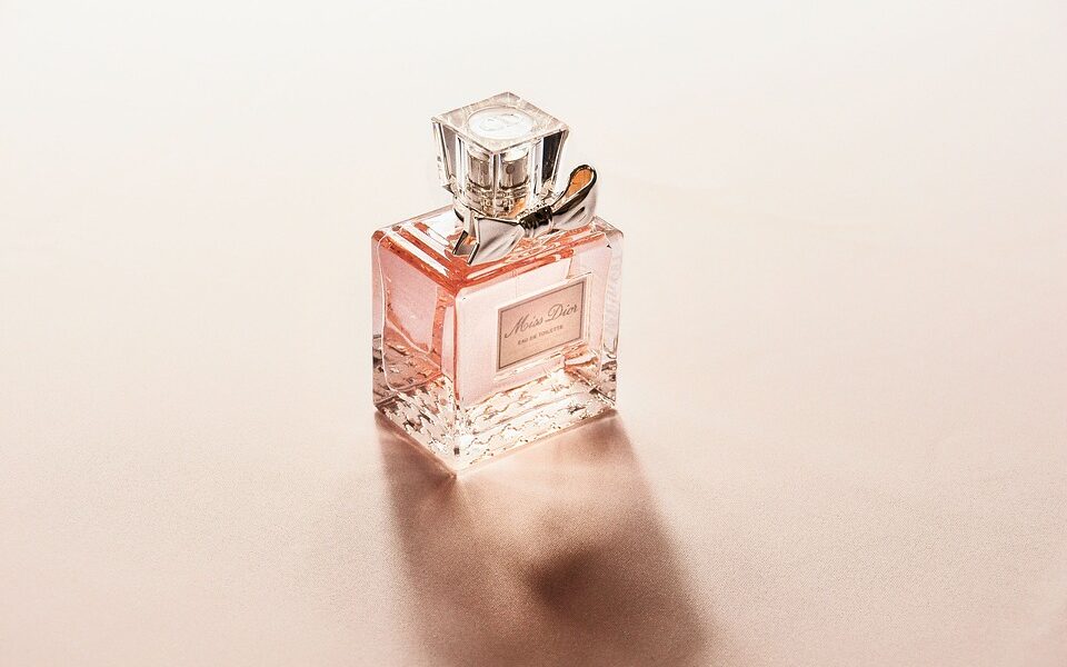 pink bottle of perfume