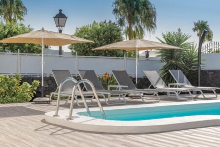 villa pool with umbreelas